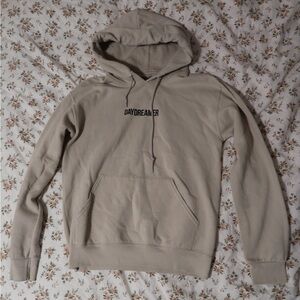beige daydreamer hoodie black text